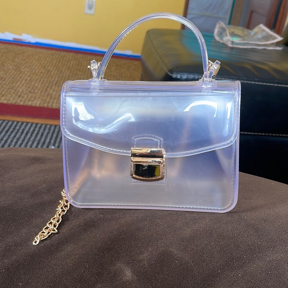 Transparent shoulder bag with gold chain